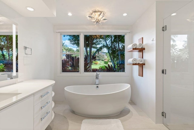 bathroom with vanity, tile patterned floors, and independent shower and bath