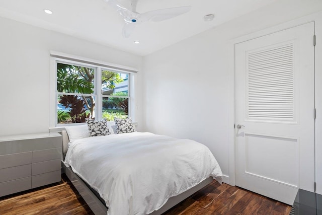 bedroom featuring dark hardwood / wood-style floors and ceiling fan