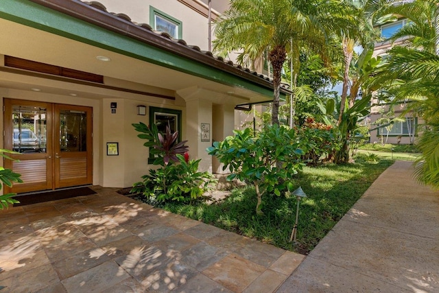 entrance to property featuring french doors