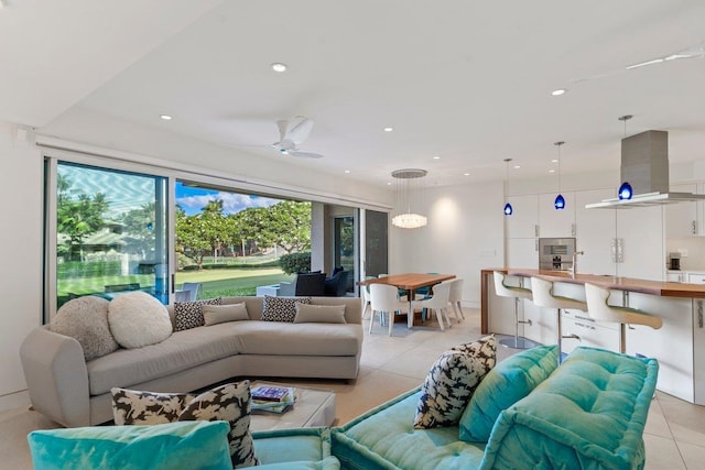 tiled living room featuring ceiling fan