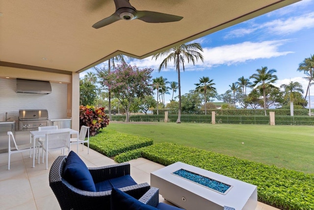 view of patio with a grill, ceiling fan, and a fire pit