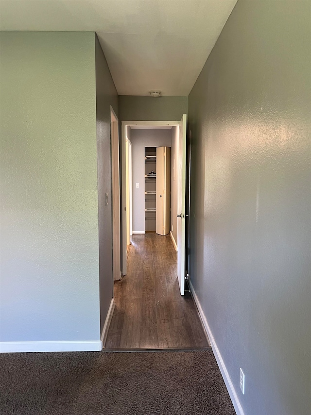 hall with dark hardwood / wood-style flooring