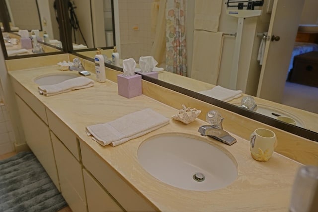 bathroom featuring dual vanity