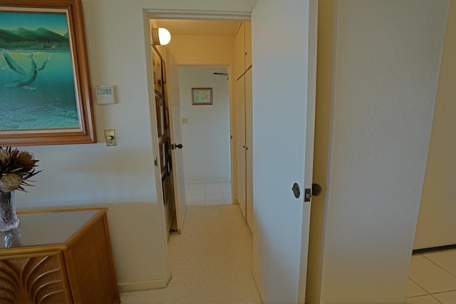 hallway with light tile floors