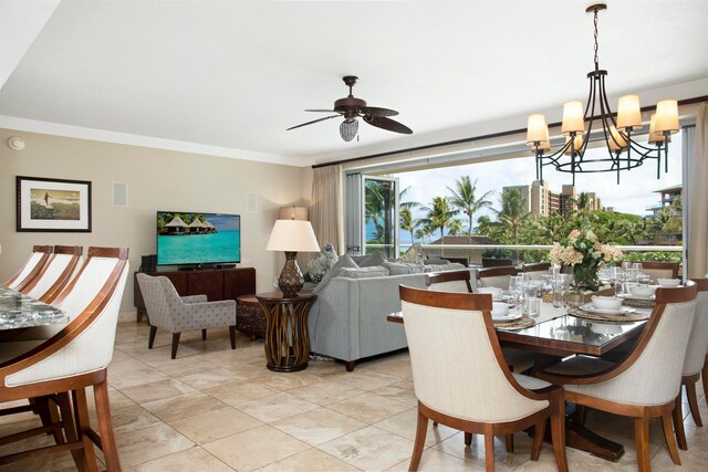 dining room with crown molding and ceiling fan with notable chandelier