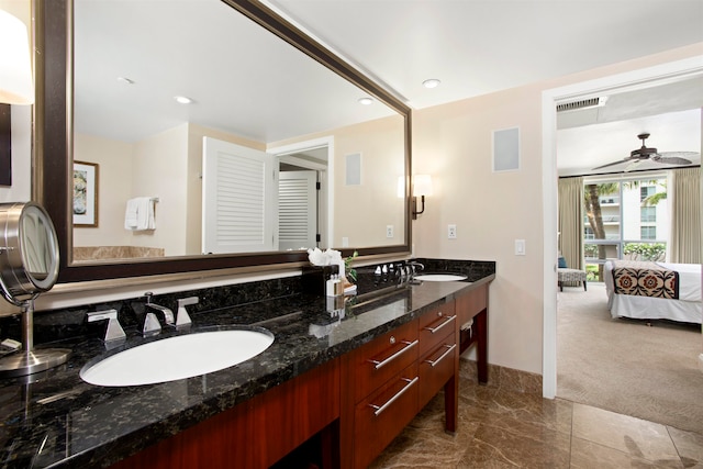 bathroom featuring vanity and ceiling fan