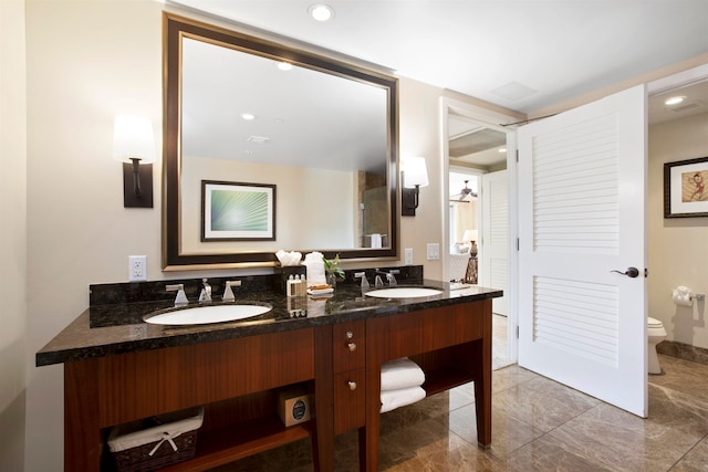 bathroom with toilet and vanity