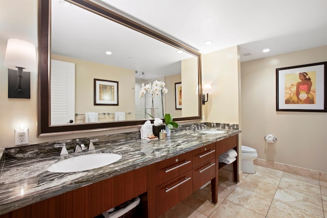 bathroom with toilet and vanity