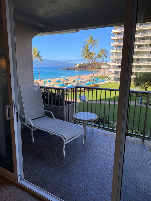 balcony featuring a water view