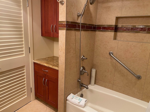 bathroom with vanity, tile patterned flooring, and tiled shower / bath combo