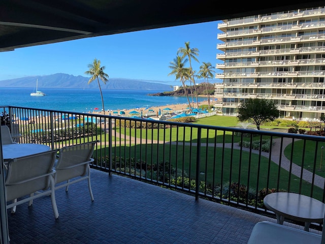 balcony with a water and mountain view