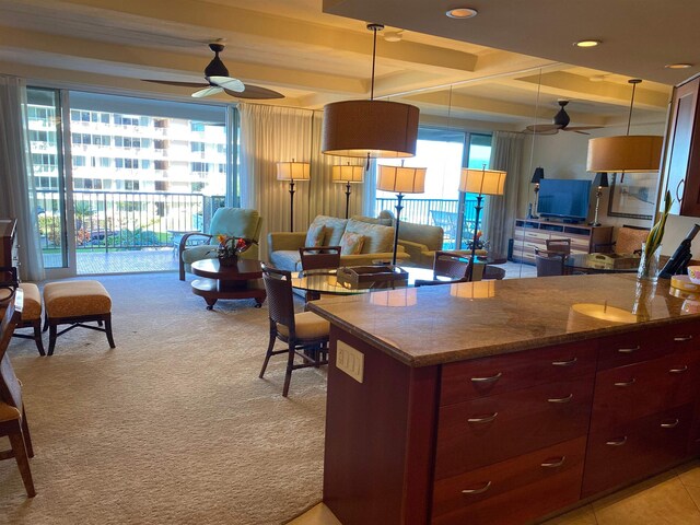 kitchen with ceiling fan, pendant lighting, and plenty of natural light