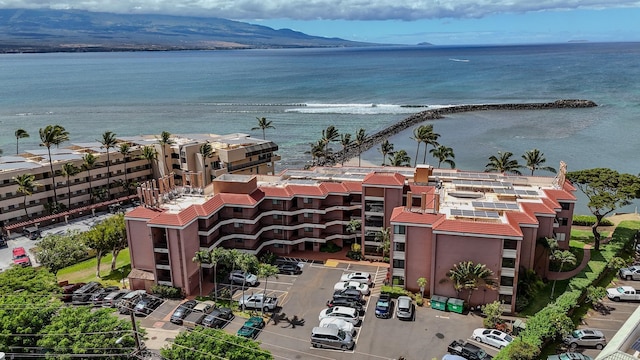 drone / aerial view with a water and mountain view