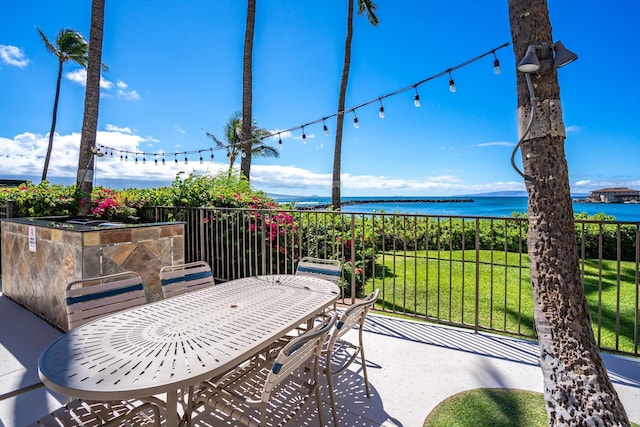 view of patio / terrace featuring a water view