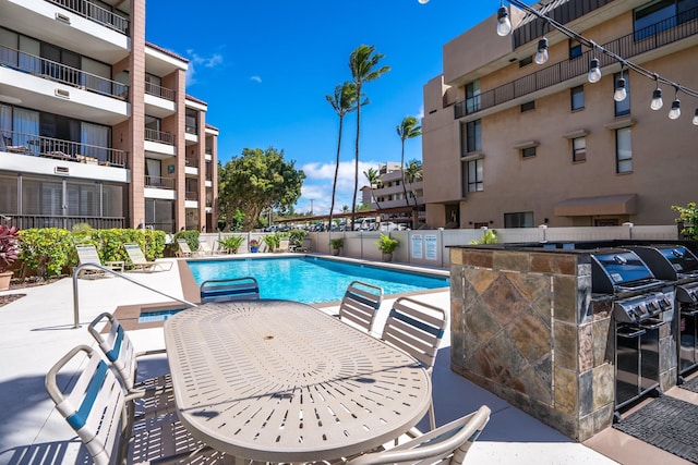 view of swimming pool featuring a patio area