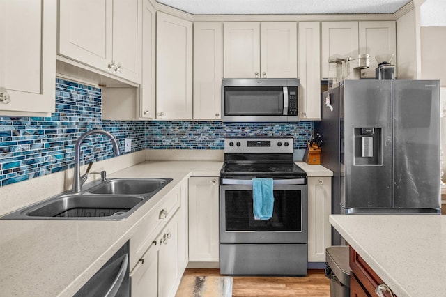 laundry area featuring washer and clothes dryer and electric water heater