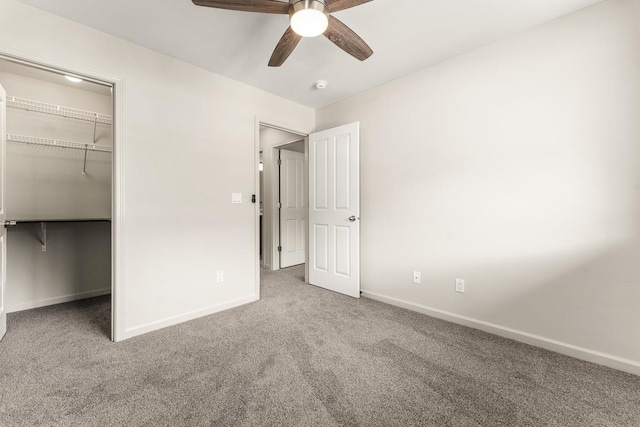 unfurnished bedroom featuring a closet, ceiling fan, and carpet