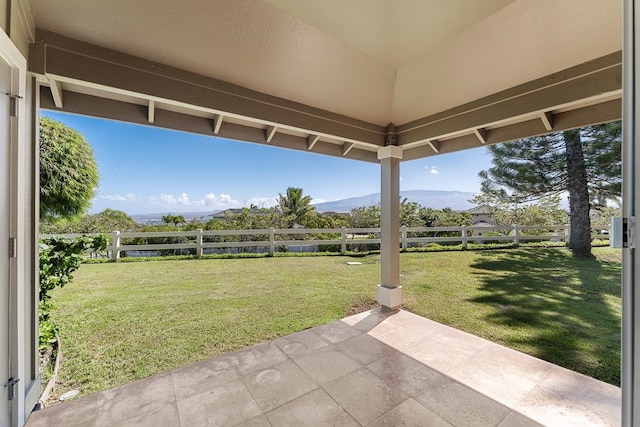 view of yard with a patio and a mountain view