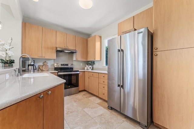 kitchen featuring tasteful backsplash, appliances with stainless steel finishes, sink, and light brown cabinets