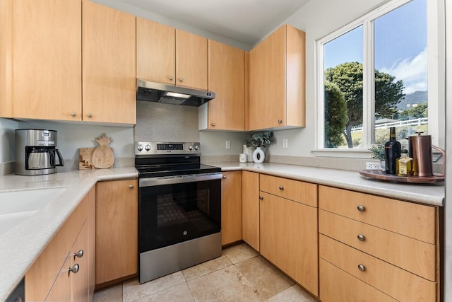 kitchen with light brown cabinetry and stainless steel electric range