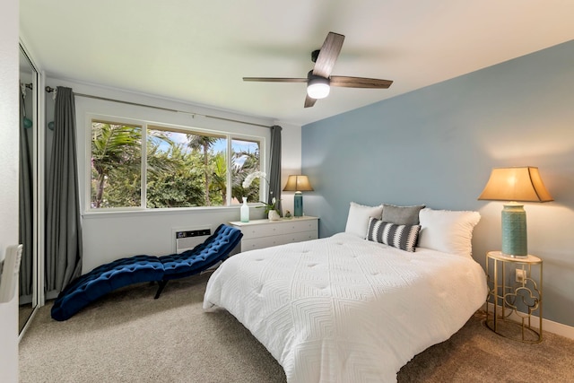 carpeted bedroom with a wall mounted AC and ceiling fan