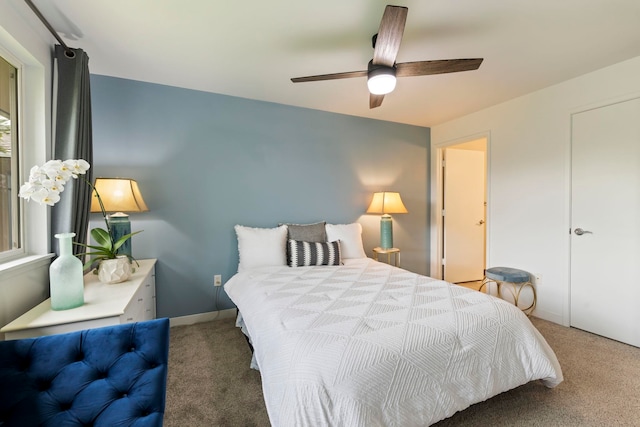 carpeted bedroom featuring ceiling fan