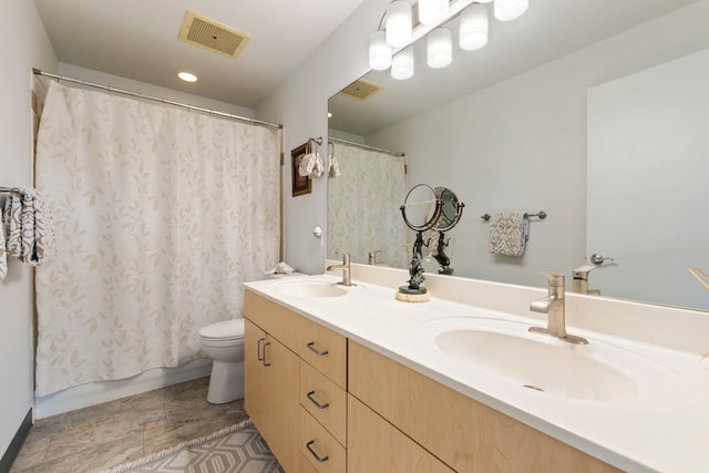 full bathroom featuring toilet, vanity, and shower / bathtub combination with curtain