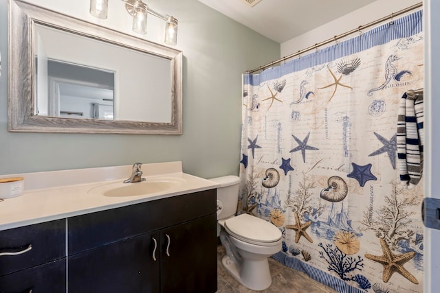 bathroom with vanity and toilet