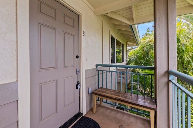 entrance to property with a balcony