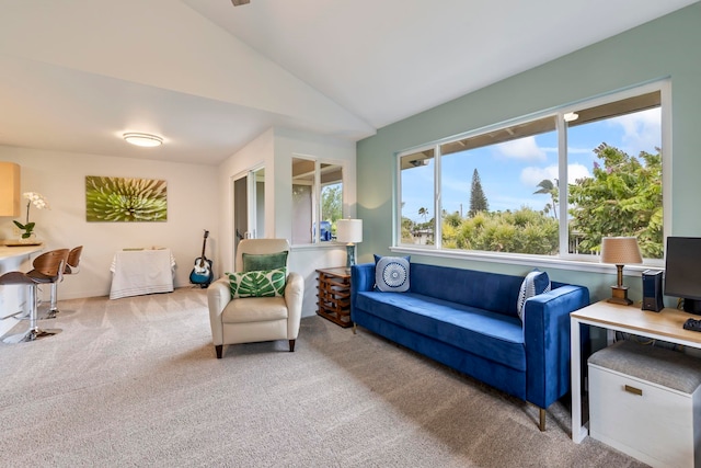 living room featuring a wealth of natural light, vaulted ceiling, and carpet