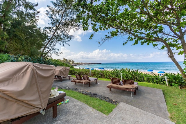 view of patio featuring a water view and area for grilling