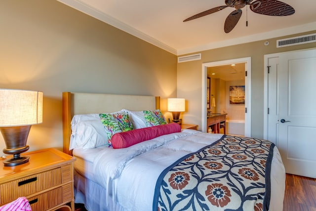 bedroom featuring crown molding, ceiling fan, wood-type flooring, and ensuite bath