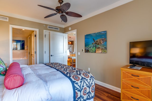 bedroom with dark hardwood / wood-style flooring, crown molding, ensuite bath, and ceiling fan