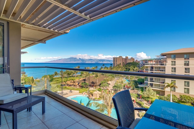 balcony with a water and mountain view