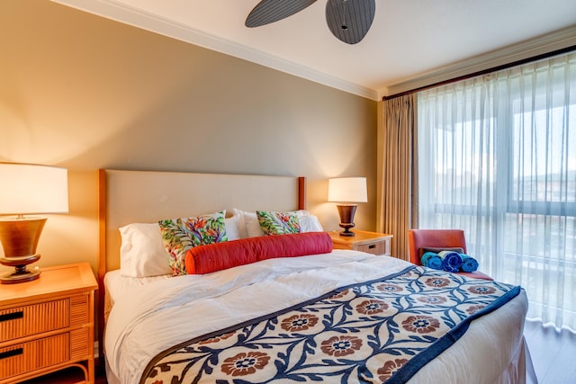 bedroom featuring ornamental molding, hardwood / wood-style flooring, and ceiling fan