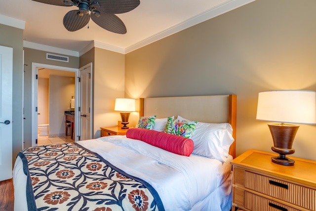 bedroom with ornamental molding, light wood-type flooring, and ceiling fan