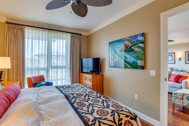 bedroom with ceiling fan, hardwood / wood-style flooring, and ornamental molding