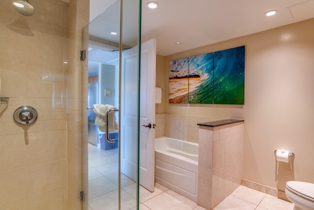 bathroom with toilet, independent shower and bath, and tile patterned flooring