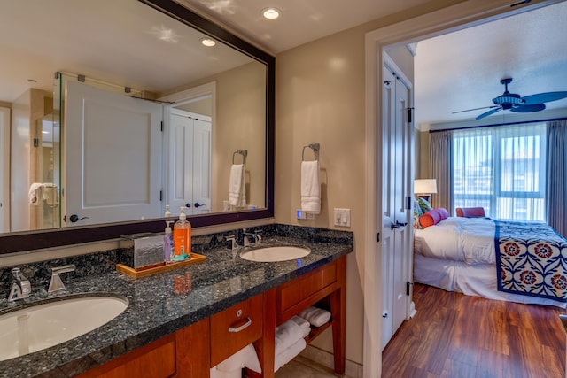 bathroom featuring vanity, wood-type flooring, and ceiling fan