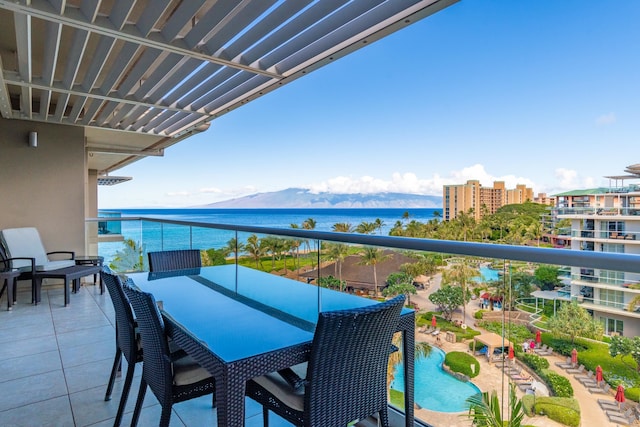 balcony with a water and mountain view