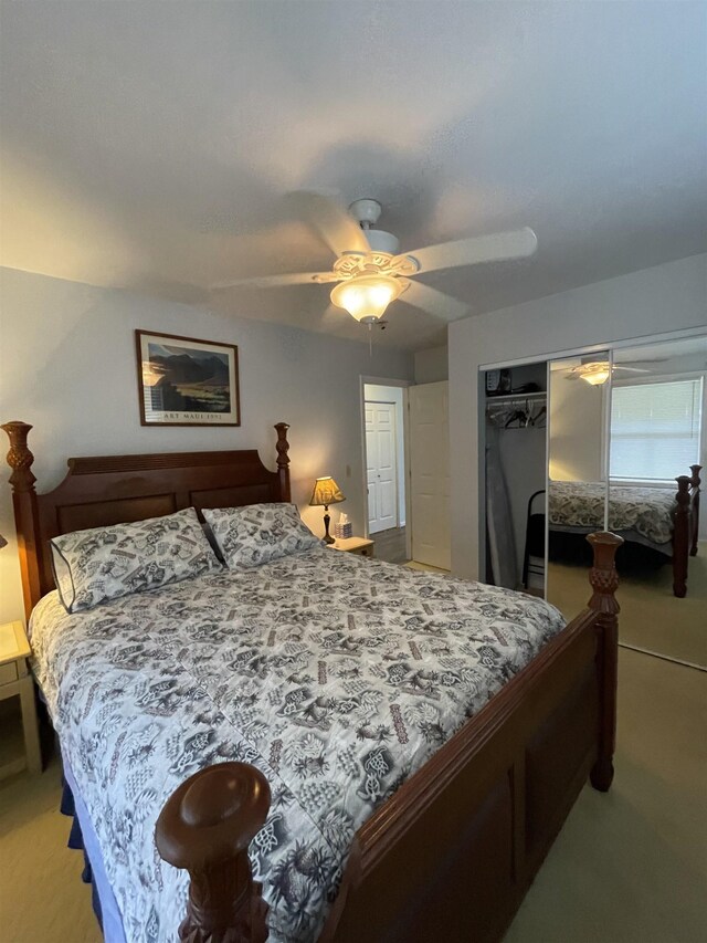 bedroom featuring ceiling fan and light colored carpet