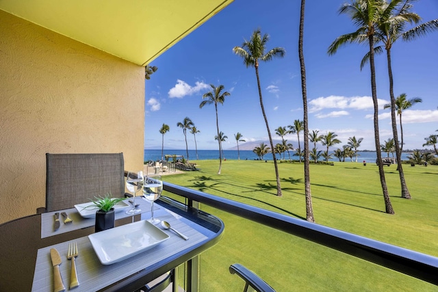 balcony featuring a water view