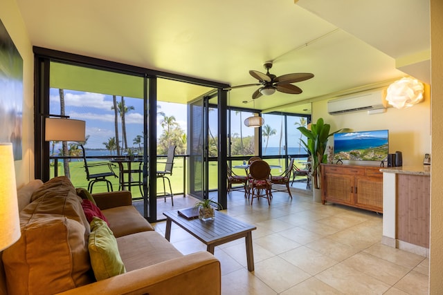 tiled living room featuring a wall unit AC, expansive windows, and ceiling fan