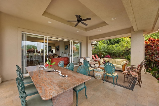 view of patio featuring an outdoor living space and ceiling fan