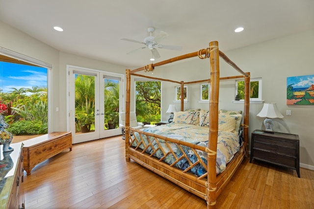 bedroom with access to outside, light hardwood / wood-style floors, french doors, and ceiling fan