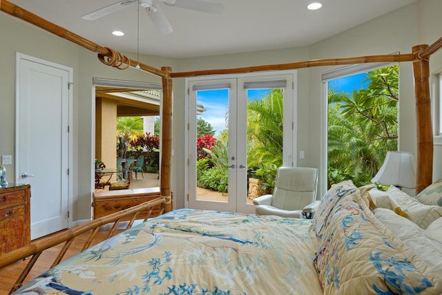 bedroom with wood-type flooring, access to outside, ceiling fan, and french doors