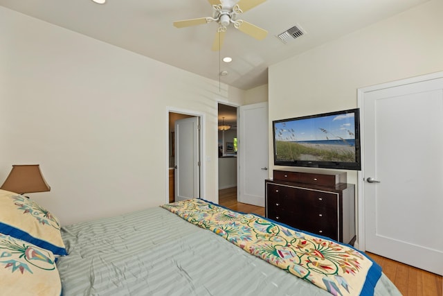 bedroom featuring light hardwood / wood-style floors and ceiling fan