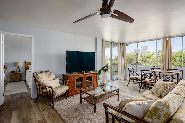 living room with ceiling fan and hardwood / wood-style floors