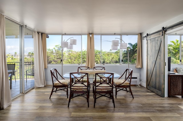 sunroom / solarium with a barn door