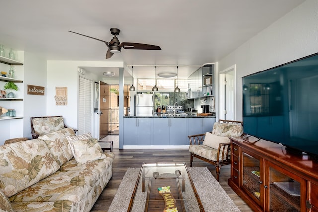 living room featuring dark hardwood / wood-style flooring and ceiling fan